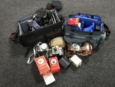 A quantity of camera equipment, lenses,