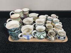 A tray of twenty Nixon & Bolam St Anthony pottery jugs - various sizes