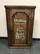 A George III and later oak corner cabinet - 'Old Shag Tobacco',