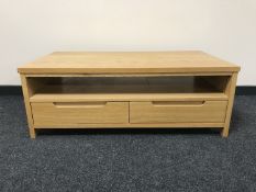 A contemporary oak audio stand