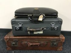 Two vintage cases and a leather brief case