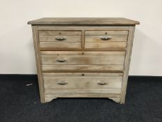 An early 20th century pine four drawer chest