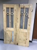 A pair of pine farmhouse glass panelled doors