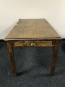 A mid 20th century oak school table fitted a drawer