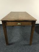 A mid 20th century oak school table fitted a drawer