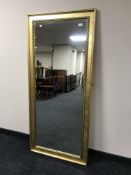 A gilt framed hall mirror