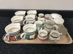 A basket of Nixon & Bolam St Anthony pottery jugs and finger bowls