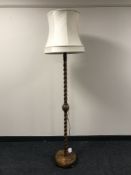 An oak barley twist standard lamp and shade