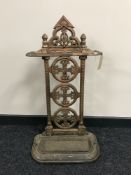 An early 20th century cast iron stick stand with lift out tray