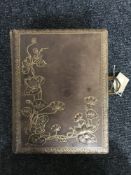 A Victorian leather bound musical photograph album