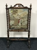 A Victorian rosewood framed tapestry fire screen