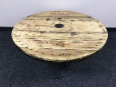 A circular industrial coffee table made from a cable spool
