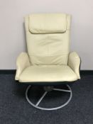 A cream leather adjustable armchair on a metal base