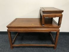 A telephone table in a mahogany finish