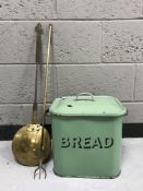 A green enamelled bread bin,
