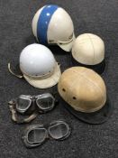 Four vintage motor cycle helmets