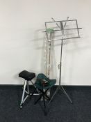 A two piece fly rod, multiplier reel, two folding tripod stools,