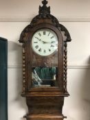 A 19th century walnut cased eight day wall clock