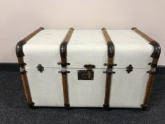 An early 20th century wooden bound trunk