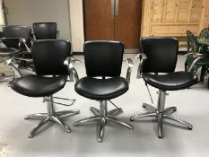 A set of three chrome framed hydraulic beauticians chairs
