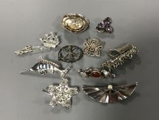Ten silver brooches (10)