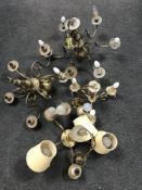 A collection of eight 20th century brass light fittings to include six-branch chandeliers,