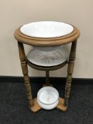 A circular wash stand with Denby wash bowl,