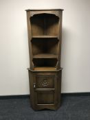 An oak corner cabinet
