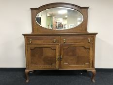 An oak mirror backed sideboard