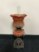 An early 20th century Duplex oil lamp with a red glass shade CONDITION REPORT:
