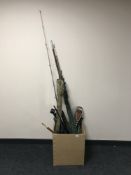A box of fishing rods, two piece snooker cue, shooting stick,