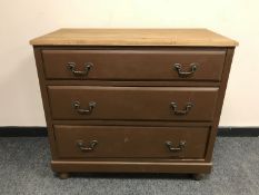 A painted pine three drawer chest,
