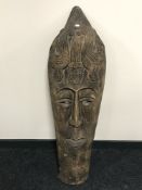 A large carved hardwood wall mask