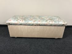 A large pine blanket box upholstered in a floral fabric
