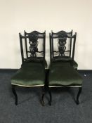 A set of four late Victorian ebonised dining chairs