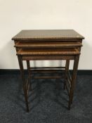 A nest of three Victorian inlaid mahogany tables