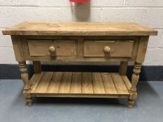 A reclaimed pine dresser base fitted with two drawers,