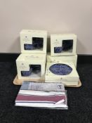 A fourteen piece boxed Ringtons chintz tea service and a pack of Ringtons tea towels