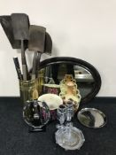 A brass stick pot and four shovels, oval framed mirror, companion set, pair of vases,