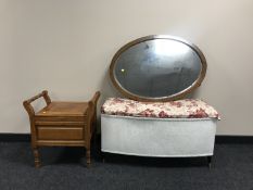 An early 20th century oval framed mirror,