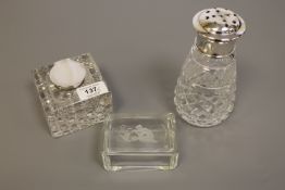 A cut glass inkwell with silver lid,