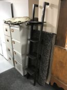 A contemporary painted pine wall shelf, a rug,