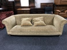 A Chesterfield style settee with cushions