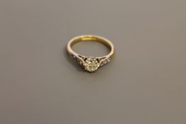 An 18ct gold solitaire diamond ring, approximately 0.5ct, size J, set with diamond shoulders.