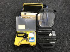 A basket of chisels, sharpening stone, socket set,