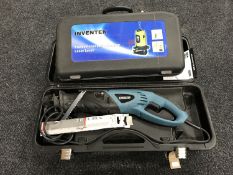 An Erbauer reciprocating saw and a cased laser level