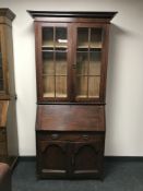An Edwardian oak bureau bookcase