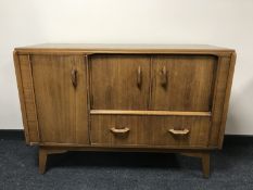 A mid 20th century teak G Plan cocktail sideboard