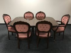 A twin pedestal Regency style dining table with leaf and six dining chairs