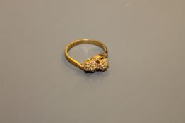 An 18ct gold double cluster ring
